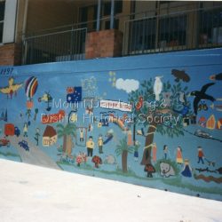 Colour photograph of section of mural wall painted by parents and students to commemorate the school centenary 1897 - 1997.