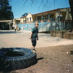 Zachary James Robertson pictured in the Miss Bell Playground at Mount Dandenong Primary in 1997, the year of the school's centenary.