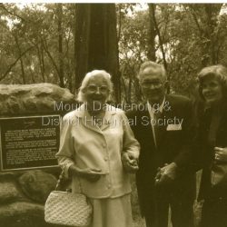 Three visitors at the cairn marking the site of the October 1938 crash of the aircraft Kyeema.