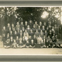 Formal school photograph of the students at Mt Dandenong State School taken in 1942. Mounted on stiff cardboard.: Handwritten on back of photograph: Betty Jeeves (Law Smith) 1st right middle row Stamp G. E. Hains Photographer 654 CANTERBURY Rd. SURREY HILLS, E10