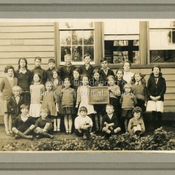Formal School photograph taken of students in front of school building in 1932.: On back of photograph a stamp: G.E.HAINS Photographer 61 HARCOURT ST. HAWTHORN EAST. E3 1/6