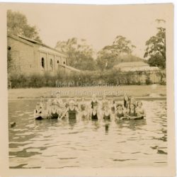Mount Dandenong State School pupils in the water at Lilydale Baths during a swimming lesson in 1938.: On Back of photograph: Pupils (Mount Dandenong) at Lilydale Baths 1938?