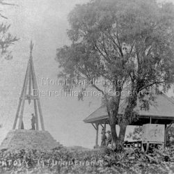 The observatory at Mt Dandenong with two people standing on the lookout structure and two others in the pavilion.