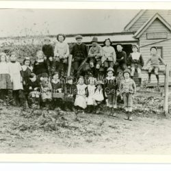 Left to Right Top: ?, Bill Stafford, Charlie Tait, Bob Logan (High hat), George Stafford, Jack Clarke, Alf Walker, ? Girls standing: Lily Tait, ?, Florence Jeeves, Eileen Hayes Front: Kitty Logan, Bella Logan, Zemo?? Fenton, ?, Pop?? Stafford, Elsie Stafford, ? Boys: Ken Hayes?, Henry Badenhop?