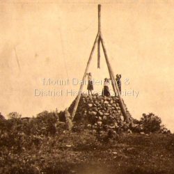 Photo, copied from the Tourists' Guide to the Dandenong Mountains (1904). Note lack of cross pieces in the trig point quadrapod showing this photo be earlier than the ones showing cross pieces