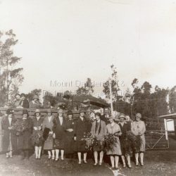 St Matthew's Church Girls Friendly Society Outing with transport provided by Wally Breen's truck. Scene shows group of girls in front of truck, some holding large bunches of flowers. circa late 1920s. From back L - R Vi Hardon, Edna Eakin, Florrie James, ?, ?, Mrs Eakin, Sheila Shellow, Mrs Hamilton, Iris Dorey, ?, Mrs Wally Breen, Nora McLarty, Mavis Giddens, Wally Breen, Rita Shaw, Jessie Lyle.