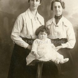 Studio portrait of Edith Emma Dorey (nee Spooner), wife of Fred Dorey, with her mother and baby Fred. c1919