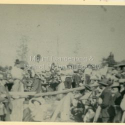 View of spectators and participants at the Wood Chop event during the Olinda Sports Carnival, Easter Monday 1909. The descriptive text on the reverse of this photograph was hand written by John Lundy-Clarke.: Wood chop Olinda 1909. Easter Monday Sports
