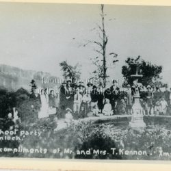 Staged photograph of 'Olinda School Party' at Kenloch. Used as a Christmas card by the Kenloch owners Mr & Mrs T. Kennon in 1923. The Kennon family were strong supporters of Olinda State School.