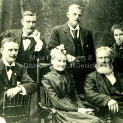 Formal photograph of the Park family who took up Lot 16, Section 3 of the Mooroolbark Village Settlement. L - R are George, Jack, Mrs Park (Elspeth), Will, Mr Park, Mary (Mrs McGowan). The descriptive text on the reverse of this photograph was hand written by John Lundy-Clarke. The Park Family of Olinda L to R George Jack Mrs Park (Elspeth) Will Mr Park Mary (Mrs McGowan)