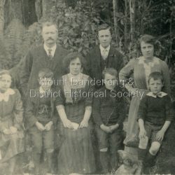 Posed group photo of the Curry family. 10 people in the photo.