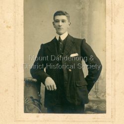 Studio photo taken of Jack Lees, brother of Lena Green (nee Lees). Photograph taken by W. Mason & Co. of 144 Bridge Road Richmond, Melbourne.Photograph framed in thick cardboard. Handwritten on back in black pen: Lena Green's Brother Jack Lees Older writing in pencil: My sisters son E.C. Dorey