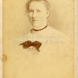 Studio photograph of Mary Dorey (1883-1918). The photograph, mounted on thick cardboard was taken by Stewart & Co. 284 - 286 Bourke Street, Melbourne.: Handwritten on back: Mary Dorey
