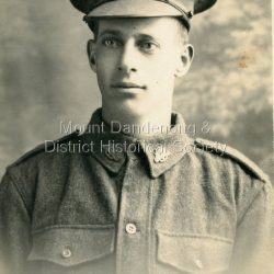 Photograph of Frank Gill in WW1 uniform. Postcard from "Kitchener Studio" Broadmeadows Camp. "Ainar Studio" Auburn.: Handwritten on back: Frank Gill Mary's Boyfriend?