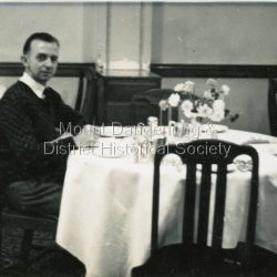 Well groomed man (unknown) seated at a table possibly at Quamby café Well groomed man (unknown) seated at a table possibly at Quamby café