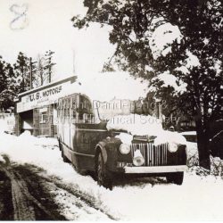 US motor coach parked at Olinda depot in snow.