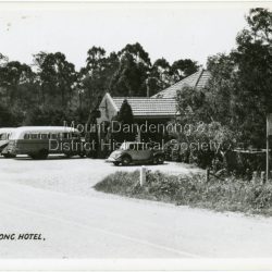 Two coaches and a car parked outside Mount Dandenong Hotel, Olinda