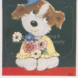 Valentine's Mailing Novelty, thick card postcard with a flap that when opened reveals a strip of 10 black and white photos of the Dandenong Ranges. Strip can be seen in OLI0266a