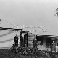 Group of four people standing outside Sunnyside, country home of John Garibaldi and Roberta Roberts at South sassafras (now Kallista).
L to R: J G Roberts, Frank Roberts, D M Anderson, Gwen Roberts.
