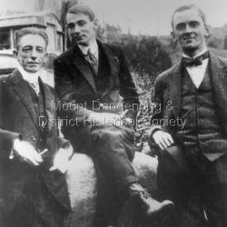 Three men on The Rock at Sunnyside. Omnibus in the background.
L to R: C.J. Dennis, Hal Gye (artist and writer), David Low (cartoonist).