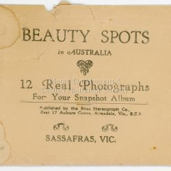 This set of small photographs was produced by the Rose Stenograph Co. c1913 to be included in photograph albums. The 1913 date cannot be correct becasue of the cars visible in and the fact that electricity arrived in 1927. The area known as South Sassafras, was opened up for settlement in 1893 and the name was changed to Kallista in 1925.
A small, paper envelope containing 12 photographs of Sassafras that are reproductions of Rose Series postcards. There are 10 different photographs, SAS0032-01and SAS0032-03 have doubles.
Envelope: Beauty Spots in Australia 12 Real Photographs For Your Snapshot Album Published by the Rose Stenograph Co. Rear 17 Auburn Grove, Armadale, Vic S.E.3 SASSAFRAS, VICTORIA
Photograph SAS0032-01 - The Rose Series P. 905: Clematis Avenue, Sherbrooke, Vic
Photograph SAS0032-02- The Rose Series P. 1603: The Cascades, Sassafras, Vic
Photograph SAS0032-03- The Rose Series P. 204: Panorama at Sassafras, Vic
Photograph SAS0032-04- The Rose Series P. 4046: Main Road, Sassafras, Vic
Photograph SAS0032-05- The Rose Series P. 1502: Sassafras Creek, Sassafras, Vic
Photograph SAS0032-06- The Rose Series P. 1501: Tourist Track, Sassafras, Vic
Photograph SAS0032-07- The Rose Series P. 4244: Tourist Track, South Sassafras, Vic
Photograph SAS0032-08- The Rose Series P. 2725: Clematis Avenue, Sherbrooke, Vic
Photograph SAS0032-09- Main Road, Sassafras, Vic
Photograph SAS0032-10- The Olinda - Sassafras Road, Vic